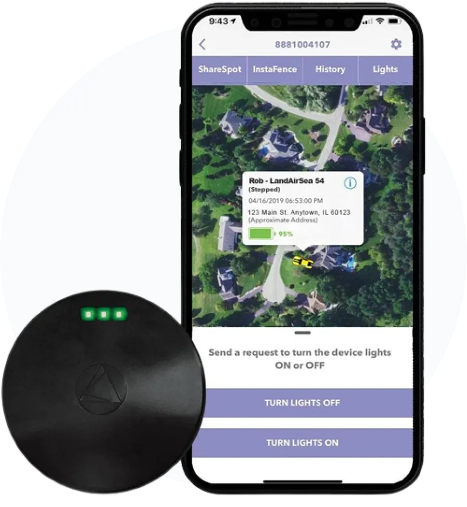 Phone showing a GPS tracker's location on a map, next to a round black tracker